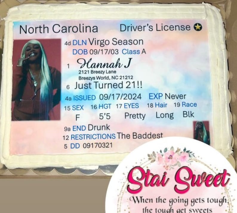 May include: A rectangular sheet cake featuring an edible print of a North Carolina driver's license. The design includes a photo of a person with long blonde hair, the name Hannah J, and text such as Virgo Season, Just Turned 21, and The Baddest.