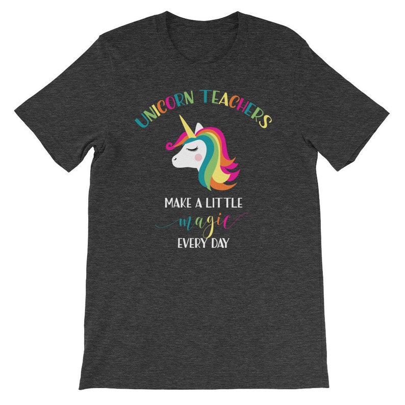 May include: Dark grey t-shirt with a rainbow unicorn graphic and the text "Unicorn Teachers Make A Little Magic Every Day".
