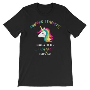 May include: Black t-shirt with a rainbow unicorn and the text "Unicorn Teachers Make a Little Magic Every Day".