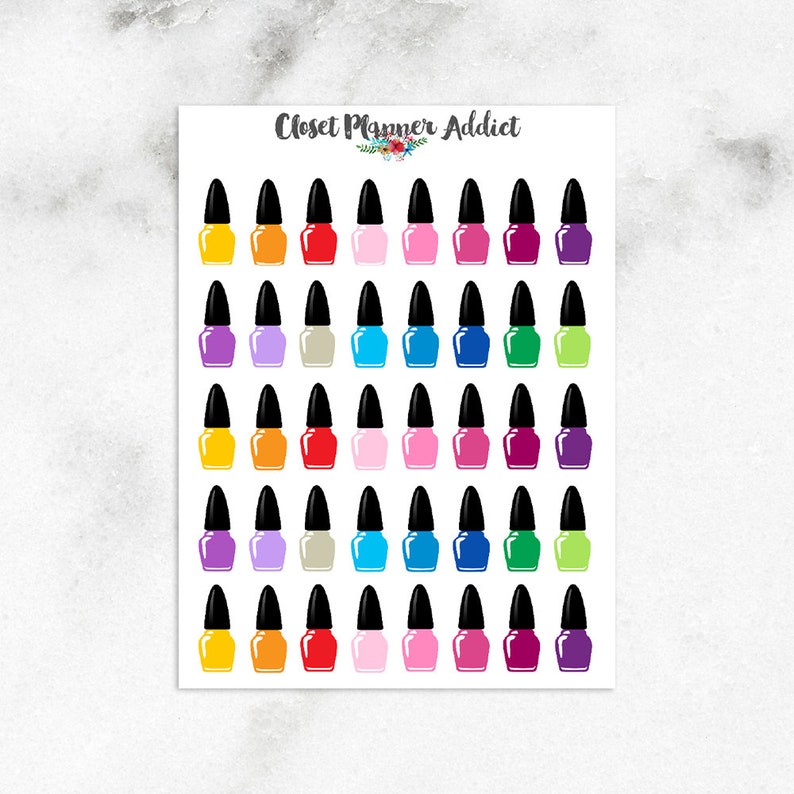 May include: A sheet of colorful nail polish stickers. The stickers are in the shape of nail polish bottles with black caps. The colors include yellow, orange, red, pink, purple, blue, green, and white.