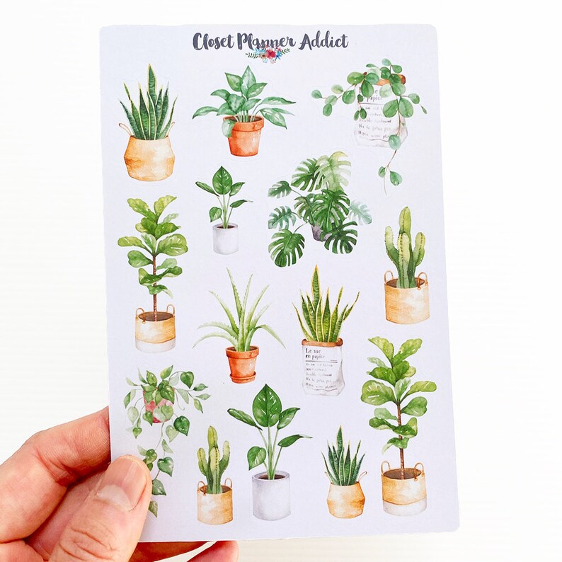 May include: A sheet of stickers featuring 14 different watercolor illustrations of potted plants. The stickers are on a white background and have the text "Closet Planner Addict" at the top.