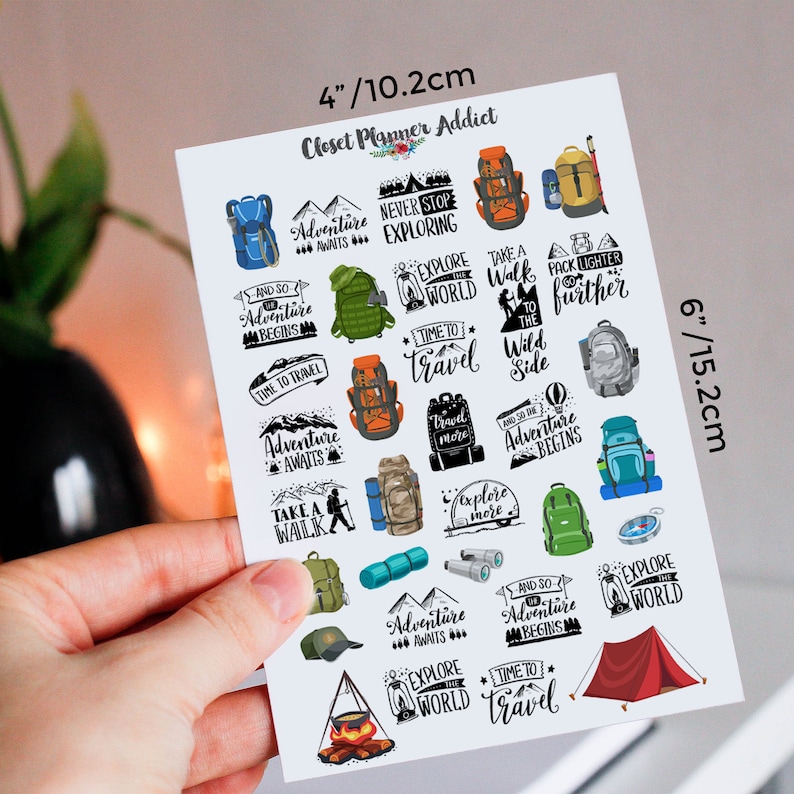 May include: A sheet of stickers featuring travel-themed designs. The stickers include backpacks, tents, and phrases like "Adventure Awaits" and "Time to Travel." The sheet measures 4 inches by 6 inches.