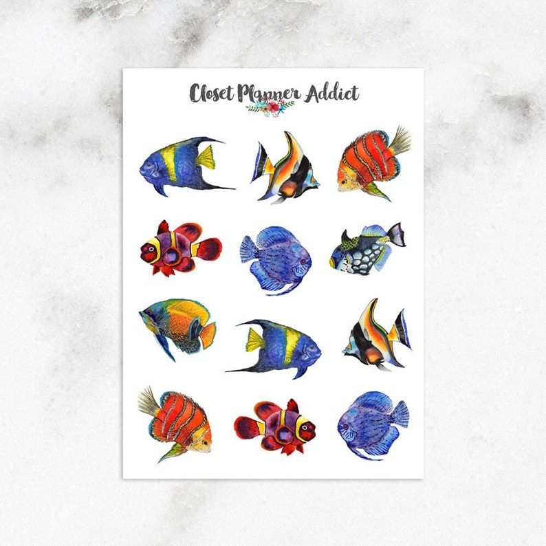 May include: A sheet of colourful fish stickers with the text "Closet Planner Addict". The stickers feature a variety of fish, including angelfish, clownfish, and pufferfish.