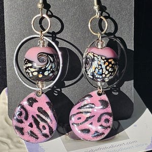 Earrings in purples. Italian glass beads. Sterling silver earring hooks. Hand made and one of a kind.