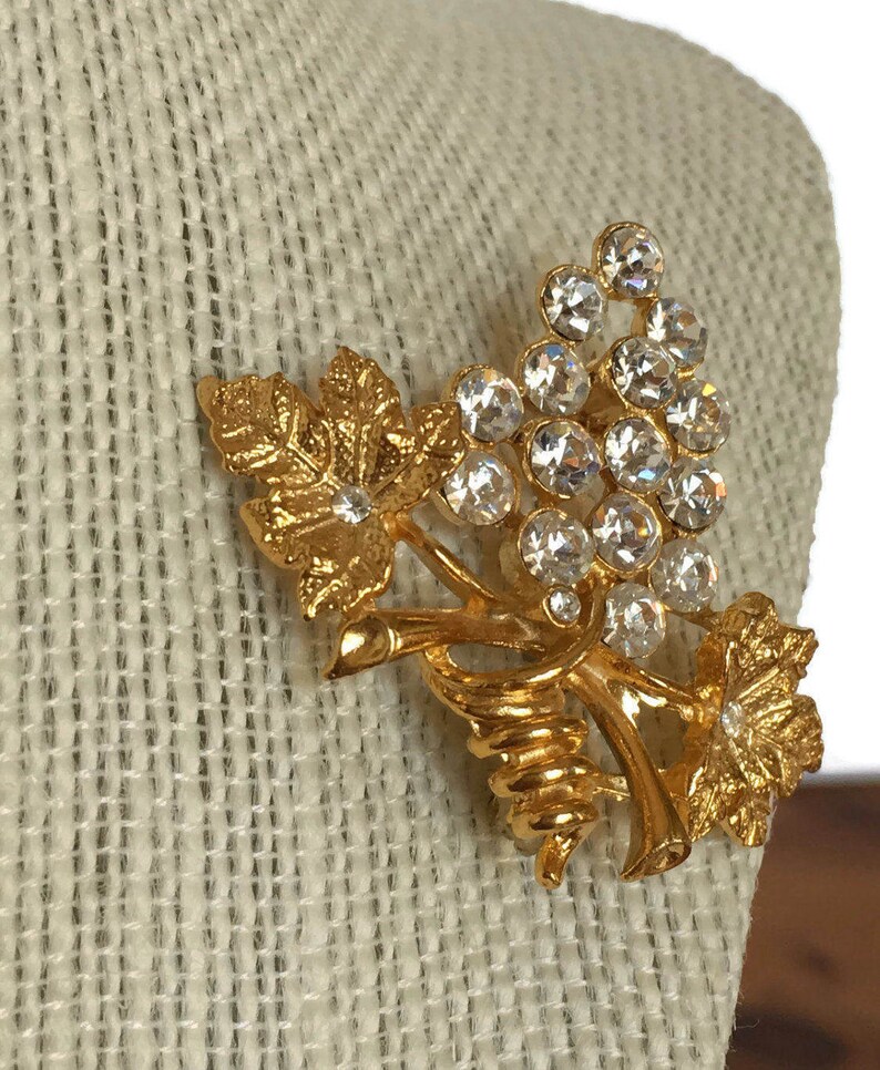 Grape and leaf cluster brooch vintage gold tone pin clear rhinestones