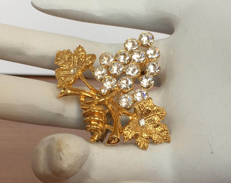 Grape and leaf cluster brooch vintage gold tone pin clear rhinestones