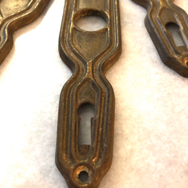 Three Vintage Brass Door and Key Plates