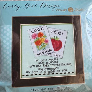 May include: Cross stitch pattern with a vintage seed packet design. The packets read "Look Within" and "Organic Trust". The text below reads "For best results stay grounded. Turn your face toward the sun, and remember. You have it all inside of you." The pattern is titled "Look Within" and measures 7.25 inches by 7.25 inches.