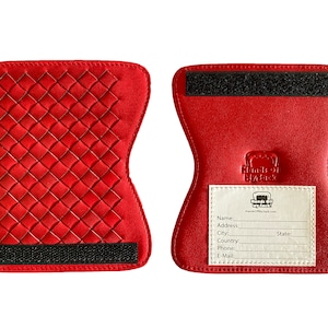 May include: A pair of red knee pads with a quilted design and velcro straps. The knee pads have a white label with the text "Hands Off My Back" and a website address.