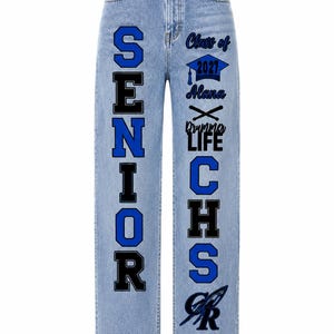 May include: Light blue denim jeans featuring a high waist and straight legs. The left leg displays the word SENIOR in large blue and black letters. The right leg features the text Class of 2027, Alana, Drummer LIFE, CHS, and a graphic logo.
