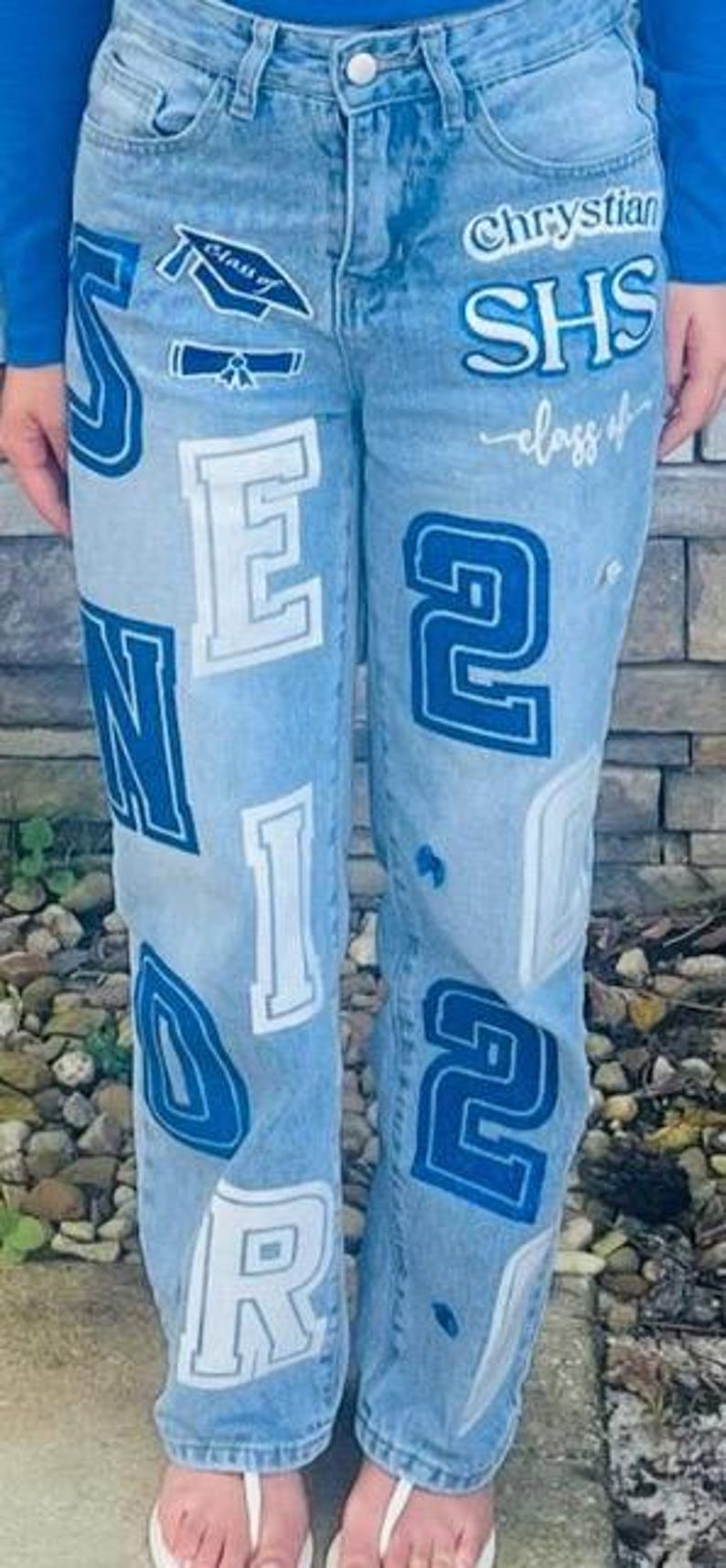 Blue glitter and white glitter with the words "SENIOR" and "2026", along with the text "Chrystian SHS class of".