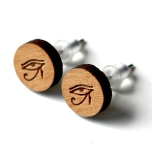 Customizable round stud earrings. Laser-cut engraved varnished wood, Egyptian eye Horus glyph jewel. Visual god pyramid egypt image 1