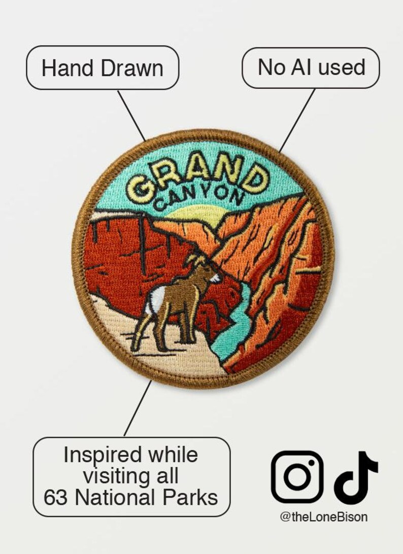 May include: Embroidered patch featuring a Grand Canyon landscape with a bighorn sheep. The patch is hand-drawn and reads "Grand Canyon" in yellow lettering. The design includes red, orange, and turquoise colors. The text "Inspired while visiting all 63 National Parks" is also included.