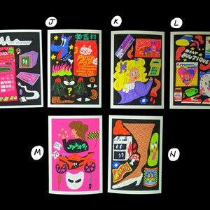 May include: A set of 10 colorful illustrations featuring various objects and characters. The illustrations are printed on white paper and framed with a black border. The illustrations include a calculator, a cat, a girl, a clock, a motorcycle, a leg, and other objects.