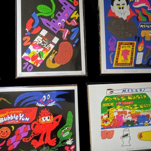 May include: A set of nine colorful prints featuring various illustrations, including a mathematical garden, a vampire, a cartoon cat, and a pear. The prints are framed in black and have white borders with text at the bottom.
