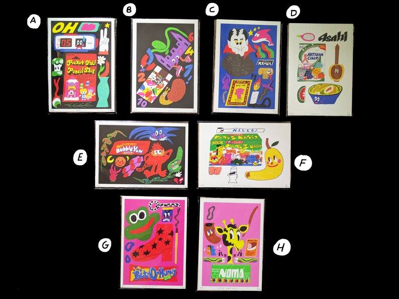 May include: A collection of eight colorful prints featuring various illustrations, including a cartoon character with a bubble gum, a giraffe with a pipe, a frog with a star, a vampire, a vending machine, a bowl of cereal, and a hand holding a pencil.
