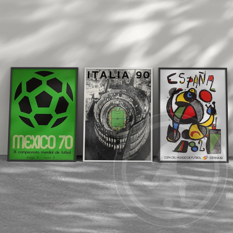May include: Three framed posters featuring soccer tournament art. The left poster is green with a black soccer ball and text reading MEXICO 70. The center poster is black and white with ITALIA 90 text. The right poster features ESPA&Ntilde;A 82 text.