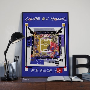 May include: A blue and white poster with the text "Coupe du Monde France 98" and a stylised illustration of a football pitch.
