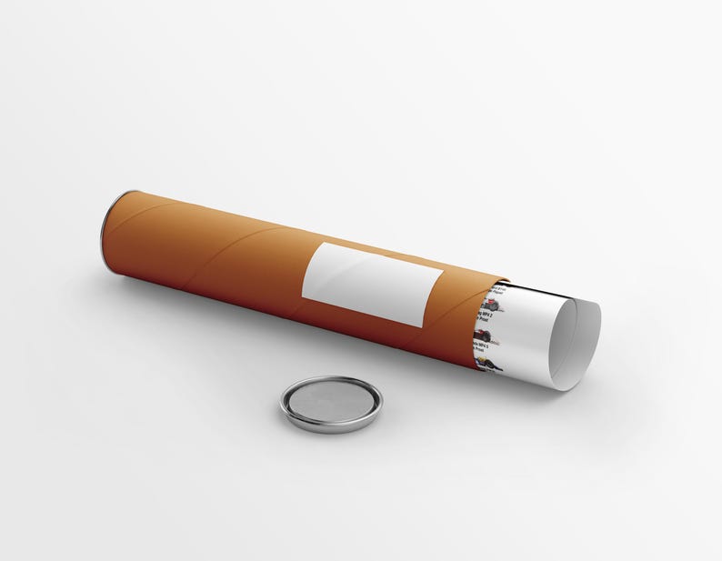 May include: A cylindrical brown cardboard mailing tube with a white rectangular label on the side. A rolled white paper document with small printed graphics is partially visible inside the tube. A separate circular metal cap lies nearby.