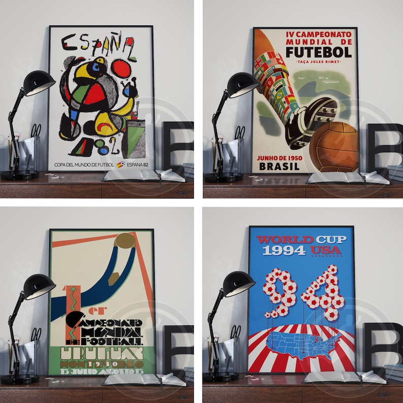May include: A set of four framed posters featuring vintage soccer tournament artwork. The prints display historical World Cup graphics from 1930, 1950, 1982, and 1994, showcasing various artistic styles, bold colors, and tournament text.