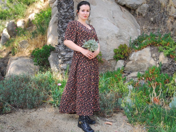 Orange and black floral dress top
