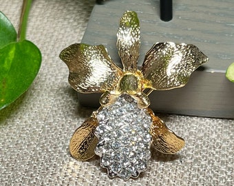 Brooch, Nolan Miller brooch -pendant ,gold tone metal orchid flower brooch-pendant with  clear glass crystals vintage