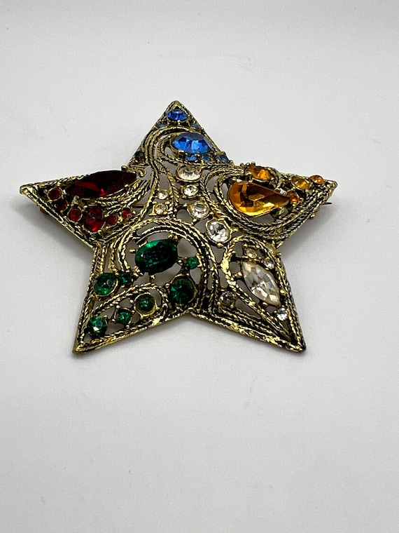 Star brooch, LA ROCO gold tone metal multicolor r… - image 1