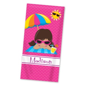 May include: Pink beach towel with a chevron pattern. A cartoon girl wearing sunglasses is lying on a blue and white striped towel under a colorful umbrella. The sun is shining and there is a glass of lemonade with a straw and a small orange umbrella. The towel is personalized with the name "Madison".