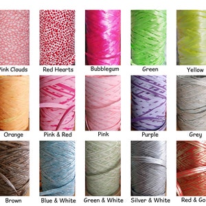 May include: A collection of spools of colorful yarn with various patterns, including blue clouds, pink clouds, red hearts, bubblegum, green, yellow, aqua and white, yellow gold, orange, pink and red, pink, purple, grey, beige, pink and white, brown, blue and white, green and white, silver and white, red and gold, and gold and white.