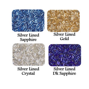 May include: Four different colors of seed beads, each with a silver lining. The colors are sapphire blue, gold, crystal clear, and dark sapphire blue.  The beads are arranged in a grid of four squares.