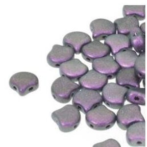 May include: A pile of small, iridescent purple and gray glass beads in a teardrop shape with two holes. The beads are approximately 5mm in size.