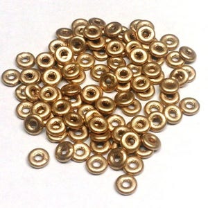 O Bead Aztec Gold, 1X4MM Czech Glass 01710, 5 or 10 grams