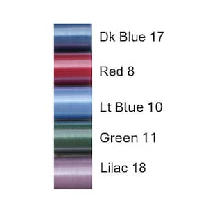 May include: Six spools of thread in various colors, including dark blue, red, light blue, green, and lilac. The spools are labeled with the color and the number of yards of thread on each spool.
