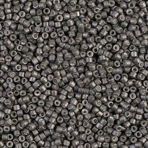 May include: A close-up shot of a pile of small, cylindrical, dark gray beads. Each bead has a hole running through the center. The beads are densely packed together, creating a textured surface.