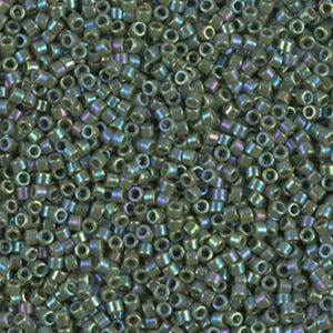 May include: Close-up of a pile of small, cylindrical beads. The beads are a muted olive green color with an iridescent sheen that reflects hints of purple and blue. The beads are uniform in size and shape, ideal for jewelry making.