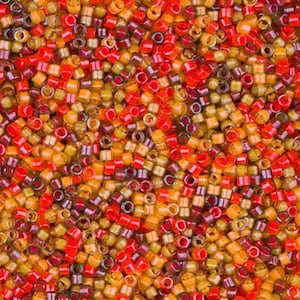 May include: A close-up view of a pile of small, cylindrical beads in shades of red, orange, yellow, and brown. The beads are densely packed together, creating a textured surface. The beads appear to be made of glass or a similar material, with a glossy finish.