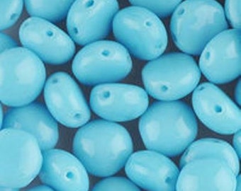 May include: A collection of light blue, oval-shaped beads with a glossy finish. Each bead has a hole for stringing. The beads vary in size and shape, creating a textured, close-up view.