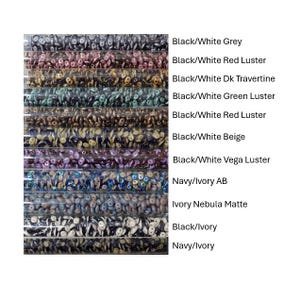 May include: A close-up view of ten tubes of seed beads, each tube containing a different color and finish. The beads are arranged in a vertical row, with the colors and finishes labeled below each tube. The colors and finishes include: Black/White Grey, Black/White Red Luster, Black/White Dk Travertine, Black/White Green Luster, Black/White Red Luster, Black/White Beige, Black/White Vega Luster, Navy/Ivory AB, Ivory Nebula Matte, Black/Ivory, and Navy/Ivory.