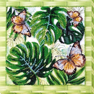 May include: A beaded artwork featuring green tropical leaves and three butterflies with orange, brown, and white wings. The artwork is framed with a green border and has a light green background.