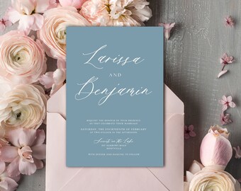 May include: A light blue wedding invitation with white calligraphy that reads "Larissa and Benjamin". The invitation details the wedding date, time, and location: "Saturday, the Fourteenth of February at Two o'clock in the afternoon, Secrets in the Lake, 347 Narrows Road, Montville. With dinner and dancing to follow."
