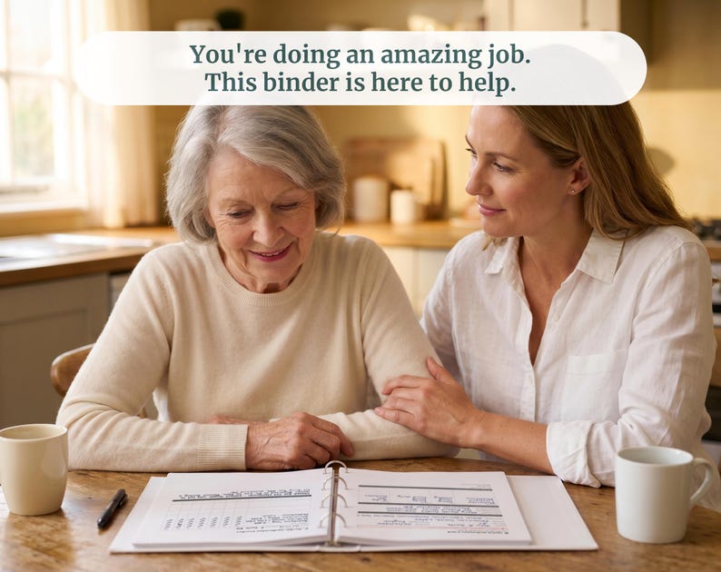 May include: A white three-ring binder lies open on a wooden table, displaying printed pages with charts and text. The text at the top of the image reads, "You're doing an amazing job. This binder is here to help." Two white ceramic mugs are present.
