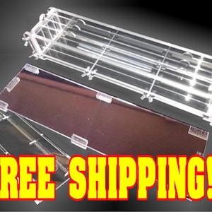 May include: A set of three clear acrylic display cases for organizing and showcasing items. The cases are made of clear acrylic and have a modern, minimalist design. The cases are designed to be stacked on top of each other. FREE SHIPPING!!!