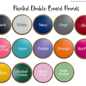 May include: A collection of fourteen circular wooden boards with painted surfaces in various colors including black, white, navy, grey, red, bubble gum pink, aqua, purple, orange, hot pink, yellow, hunter green, blush pink, and sage green.