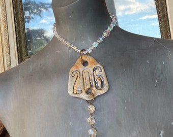 Vintage crystal necklace with vintage metal tag