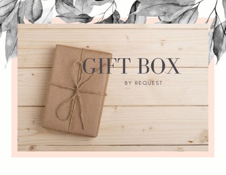 May include: A brown gift box tied with twine on a wooden background. The text "GIFT BOX BY REQUEST" is printed on the background.