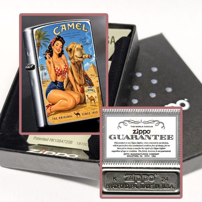 May include: A silver Zippo lighter with a vintage Camel cigarettes graphic featuring a woman, a camel, and pyramids. The lighter is in a black box with a guarantee card and a metal base with "Zippo" and "Made in USA" text.