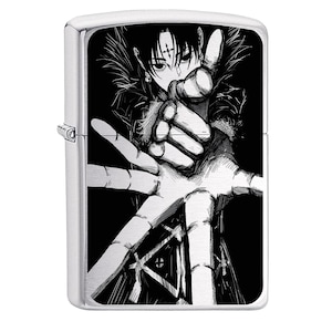 May include: A silver-colored lighter featuring a black and white manga illustration of a character reaching out. The artwork depicts a person with dark hair and a cross-shaped marking on their forehead, set against a black background.
