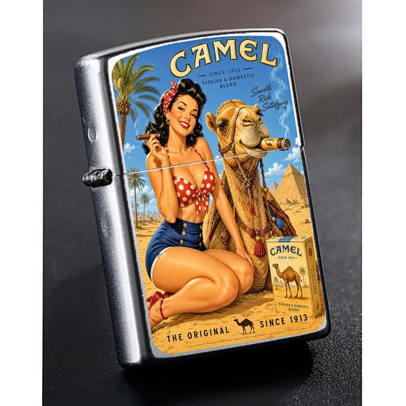 May include: A silver metal lighter with a vintage Camel cigarettes advertisement. The artwork features a woman in a red polka dot bikini and blue shorts, a camel, and pyramids. The text on the lighter reads "CAMEL SINCE 1913".