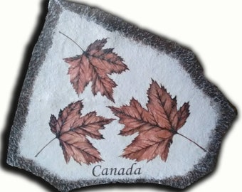 Hand Painted artwork of Canadian Artist Doreen Gordon-Cooper on Stone