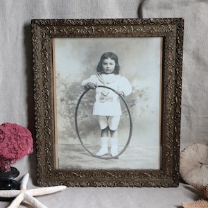 Antique french black and white large portrait photo of little Edwardian period boy with a hoop. Gilded frame. Victorian decor. Napolean III
